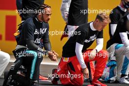 Lewis Hamilton (GBR) Mercedes AMG F1 and Sebastian Vettel (GER) Ferrari on the grid.                                02.08.2020. Formula 1 World Championship, Rd 4, British Grand Prix, Silverstone, England, Race Day.