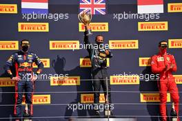 The podium (L to R): Max Verstappen (NLD) Red Bull Racing, second; Lewis Hamilton (GBR) Mercedes AMG F1, race winner; Charles Leclerc (MON) Ferrari, third.                                02.08.2020. Formula 1 World Championship, Rd 4, British Grand Prix, Silverstone, England, Race Day.