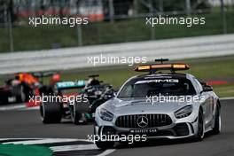 Lewis Hamilton (GBR) Mercedes AMG F1 W11 leads behind the FIA Safety Car.                                02.08.2020. Formula 1 World Championship, Rd 4, British Grand Prix, Silverstone, England, Race Day.