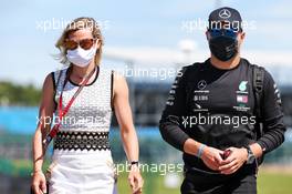 Valtteri Bottas (FIN) Mercedes AMG F1 with his girlfriend Tiffany Cromwell (AUS) Professional Cyclist. 30.07.2020. Formula 1 World Championship, Rd 4, British Grand Prix, Silverstone, England, Preparation Day.