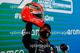 Race winner Lewis Hamilton (GBR) Mercedes AMG F1 is presented with the helmet of Michael Schumacher (GER) in parc ferme after equalling the record for the number of F1 victories. 11.10.2020. Formula 1 World Championship, Rd 11, Eifel Grand Prix, Nurbugring, Germany, Race Day.