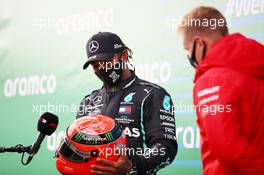 Race winner Lewis Hamilton (GBR) Mercedes AMG F1 is presented with the helmet of Michael Schumacher (GER) by Mick Schumacher (GER) in parc ferme after equalling the record for the number of F1 victories. 11.10.2020. Formula 1 World Championship, Rd 11, Eifel Grand Prix, Nurbugring, Germany, Race Day.