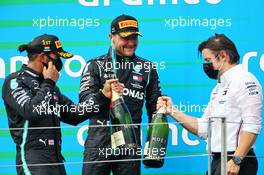 (L to R): Race winner Lewis Hamilton (GBR) Mercedes AMG F1 with third placed team mate Valtteri Bottas (FIN) Mercedes AMG F1 and Peter Bonnington (GBR) Mercedes AMG F1 Race Engineer on the podium. 19.07.2020. Formula 1 World Championship, Rd 3, Hungarian Grand Prix, Budapest, Hungary, Race Day.