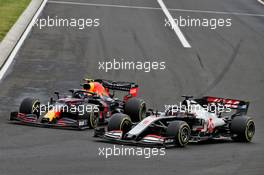 Alexander Albon (THA) Red Bull Racing RB16 and Romain Grosjean (FRA) Haas F1 Team VF-20 battle for position. 19.07.2020. Formula 1 World Championship, Rd 3, Hungarian Grand Prix, Budapest, Hungary, Race Day.