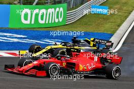 Charles Leclerc (MON) Ferrari SF1000 and Daniel Ricciardo (AUS) Renault F1 Team RS20 battle for position. 19.07.2020. Formula 1 World Championship, Rd 3, Hungarian Grand Prix, Budapest, Hungary, Race Day.