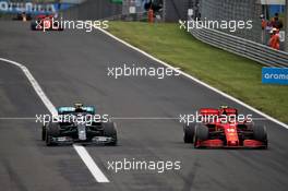 Valtteri Bottas (FIN) Mercedes AMG F1 W11 and Charles Leclerc (MON) Ferrari SF1000 battle for position. 19.07.2020. Formula 1 World Championship, Rd 3, Hungarian Grand Prix, Budapest, Hungary, Race Day.