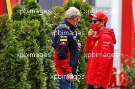 (L to R): Dr Helmut Marko (AUT) Red Bull Motorsport Consultant with Sebastian Vettel (GER) Ferrari. 18.07.2020. Formula 1 World Championship, Rd 3, Hungarian Grand Prix, Budapest, Hungary, Qualifying Day.