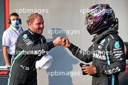 (L to R): Valtteri Bottas (FIN) Mercedes AMG F1 celebrates his pole position in qualifying parc ferme with second placed team mate Lewis Hamilton (GBR) Mercedes AMG F1. 31.10.2020. Formula 1 World Championship, Rd 13, Emilia Romagna Grand Prix, Imola, Italy, Qualifying Day.