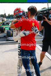 Race winner Pierre Gasly (FRA) AlphaTauri celebrates with Charles Leclerc (MON) Ferrari in parc ferme. 06.09.2020. Formula 1 World Championship, Rd 8, Italian Grand Prix, Monza, Italy, Race Day.
