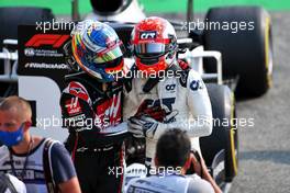 Race winner Pierre Gasly (FRA) AlphaTauri celebrates with Romain Grosjean (FRA) Haas F1 Team in parc ferme. 06.09.2020. Formula 1 World Championship, Rd 8, Italian Grand Prix, Monza, Italy, Race Day.