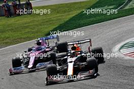 Max Verstappen (NLD) Red Bull Racing RB16 and Lance Stroll (CDN) Racing Point F1 Team RP20 battle for position. 06.09.2020. Formula 1 World Championship, Rd 8, Italian Grand Prix, Monza, Italy, Race Day.