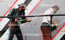 (L to R): Race winner Lewis Hamilton (GBR) Mercedes AMG F1 celebrates on the podium with Peter Bonnington (GBR) Mercedes AMG F1 Race Engineer. 25.10.2020. Formula 1 World Championship, Rd 12, Portuguese Grand Prix, Portimao, Portugal, Race Day.