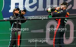 (L to R): Race winner Lewis Hamilton (GBR) Mercedes AMG F1 celebrates on the podium with Max Verstappen (NLD) Red Bull Racing. 25.10.2020. Formula 1 World Championship, Rd 12, Portuguese Grand Prix, Portimao, Portugal, Race Day.