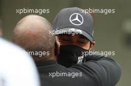 Anthony Hamilton (father of Lewis Hamilton) hugs Lewis Hamilton (GBR) Mercedes AMG F1 W11. 25.10.2020. Formula 1 World Championship, Rd 12, Portuguese Grand Prix, Portimao, Portugal, Race Day.
