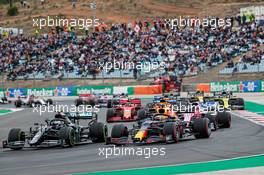 Valtteri Bottas (FIN) Mercedes AMG F1 W11 and Max Verstappen (NLD) Red Bull Racing RB16 at the start of the race. 25.10.2020. Formula 1 World Championship, Rd 12, Portuguese Grand Prix, Portimao, Portugal, Race Day.