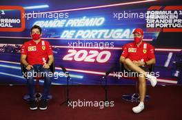 (L to R): Charles Leclerc (MON) Ferrari and team mate Sebastian Vettel (GER) Ferrari in the FIA Press Conference. 22.10.2020. Formula 1 World Championship, Rd 12, Portuguese Grand Prix, Portimao, Portugal, Preparation Day.