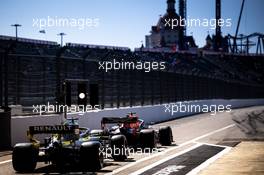 Max Verstappen (NLD) Red Bull Racing RB16 and Daniel Ricciardo (AUS) Renault F1 Team RS20 leave the pits. 25.09.2020. Formula 1 World Championship, Rd 10, Russian Grand Prix, Sochi Autodrom, Sochi, Russia, Practice Day.