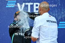 Race winner Valtteri Bottas (FIN) Mercedes AMG F1 celebrates on the podium with Dominique Riefstahl, Mercedes AMG F1 Race Support Team Leader and Test Engineer. 27.09.2020. Formula 1 World Championship, Rd 10, Russian Grand Prix, Sochi Autodrom, Sochi, Russia, Race Day.