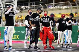 George Russell (GBR) Mercedes AMG F1 with Sebastian Vettel (GER) Ferrari on the grid. 06.12.2020. Formula 1 World Championship, Rd 16, Sakhir Grand Prix, Sakhir, Bahrain, Race Day.