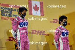 (L to R): Race winner Sergio Perez (MEX) Racing Point F1 Team celebrates on the podium with third placed team mate Lance Stroll (CDN) Racing Point F1 Team. 06.12.2020. Formula 1 World Championship, Rd 16, Sakhir Grand Prix, Sakhir, Bahrain, Race Day.