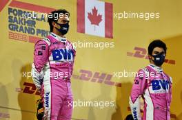 Race winner Sergio Perez (MEX) Racing Point F1 Team celebrates on the podium alongside third placed team mate Lance Stroll (CDN) Racing Point F1 Team. 06.12.2020. Formula 1 World Championship, Rd 16, Sakhir Grand Prix, Sakhir, Bahrain, Race Day.
