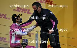 (L to R): Race winner Sergio Perez (MEX) Racing Point F1 Team celebrates on the podium with Andy Stevenson (GBR) Racing Point F1 Team Manager. 06.12.2020. Formula 1 World Championship, Rd 16, Sakhir Grand Prix, Sakhir, Bahrain, Race Day.