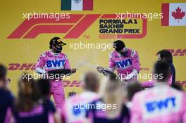 (L to R): Race winner Sergio Perez (MEX) Racing Point F1 Team celebrates on the podium with second placed team mate Lance Stroll (CDN) Racing Point F1 Team and Andy Stevenson (GBR) Racing Point F1 Team Manager. 06.12.2020. Formula 1 World Championship, Rd 16, Sakhir Grand Prix, Sakhir, Bahrain, Race Day.