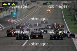 (L to R): George Russell (GBR) Mercedes AMG F1 W11, Max Verstappen (NLD) Red Bull Racing RB16, Valtteri Bottas (FIN) Mercedes AMG F1 W11, and Sergio Perez (MEX) Racing Point F1 Team RP19 at the start of the race. 06.12.2020. Formula 1 World Championship, Rd 16, Sakhir Grand Prix, Sakhir, Bahrain, Race Day.