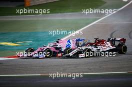 Sergio Perez (MEX) Racing Point F1 Team RP19 and Kimi Raikkonen (FIN) Alfa Romeo Racing C39 battle for position. 06.12.2020. Formula 1 World Championship, Rd 16, Sakhir Grand Prix, Sakhir, Bahrain, Race Day.