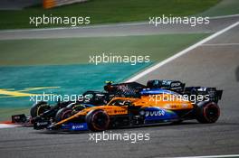Carlos Sainz Jr (ESP) McLaren MCL35 and Valtteri Bottas (FIN) Mercedes AMG F1 W11 battle for position. 06.12.2020. Formula 1 World Championship, Rd 16, Sakhir Grand Prix, Sakhir, Bahrain, Race Day.