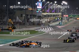 Valtteri Bottas (FIN) Mercedes AMG F1 W11 and Carlos Sainz Jr (ESP) McLaren MCL35 battle for position. 06.12.2020. Formula 1 World Championship, Rd 16, Sakhir Grand Prix, Sakhir, Bahrain, Race Day.