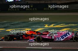 Alexander Albon (THA) Red Bull Racing RB16 and Sergio Perez (MEX) Racing Point F1 Team RP19 battle for position. 06.12.2020. Formula 1 World Championship, Rd 16, Sakhir Grand Prix, Sakhir, Bahrain, Race Day.