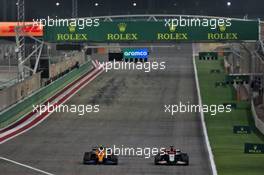 Lando Norris (GBR) McLaren MCL35 and Pietro Fittipaldi (BRA) Haas VF-19 battle for position. 06.12.2020. Formula 1 World Championship, Rd 16, Sakhir Grand Prix, Sakhir, Bahrain, Race Day.