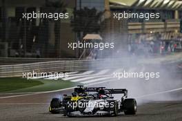 Daniil Kvyat (RUS) AlphaTauri AT01 and Daniel Ricciardo (AUS) Renault F1 Team RS20. 06.12.2020. Formula 1 World Championship, Rd 16, Sakhir Grand Prix, Sakhir, Bahrain, Race Day.