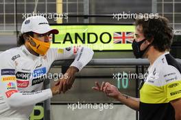 (L to R): Carlos Sainz Jr (ESP) McLaren with Fernando Alonso (ESP) Renault F1 Team. 05.12.2020. Formula 1 World Championship, Rd 16, Sakhir Grand Prix, Sakhir, Bahrain, Qualifying Day.