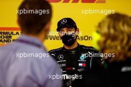 George Russell (GBR) Mercedes AMG F1 in qualifying parc ferme. 05.12.2020. Formula 1 World Championship, Rd 16, Sakhir Grand Prix, Sakhir, Bahrain, Qualifying Day.
