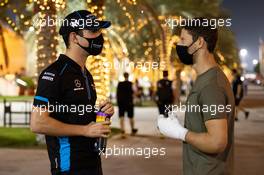 (L to R): Nicholas Latifi (CDN) Williams Racing with Romain Grosjean (FRA) Haas F1 Team. 03.12.2020. Formula 1 World Championship, Rd 16, Sakhir Grand Prix, Sakhir, Bahrain, Preparation Day.
