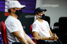George Russell (GBR) Mercedes AMG F1 with team mate Valtteri Bottas (FIN) Mercedes AMG F1 in the FIA Press Conference. 03.12.2020. Formula 1 World Championship, Rd 16, Sakhir Grand Prix, Sakhir, Bahrain, Preparation Day.