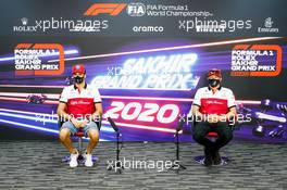 (L to R): Antonio Giovinazzi (ITA) Alfa Romeo Racing with team mate Kimi Raikkonen (FIN) Alfa Romeo Racing in the FIA Press Conference. 03.12.2020. Formula 1 World Championship, Rd 16, Sakhir Grand Prix, Sakhir, Bahrain, Preparation Day.