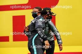 Race winner Lewis Hamilton (GBR) Mercedes AMG F1 celebrates on the podium with Stephanie Travers (GBR) Mercedes AMG F1 Trackside Fluid Engineer. 12.07.2020. Formula 1 World Championship, Rd 2, Steiermark Grand Prix, Spielberg, Austria, Race Day.