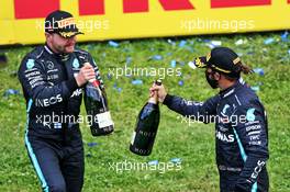 (L to R): Valtteri Bottas (FIN) Mercedes AMG F1 celebrates his second position with race winner and team mate Lewis Hamilton (GBR) Mercedes AMG F1. 12.07.2020. Formula 1 World Championship, Rd 2, Steiermark Grand Prix, Spielberg, Austria, Race Day.