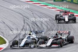 Nicholas Latifi (CDN) Williams Racing FW43 and Romain Grosjean (FRA) Haas F1 Team VF-20 battle for position. 12.07.2020. Formula 1 World Championship, Rd 2, Steiermark Grand Prix, Spielberg, Austria, Race Day.