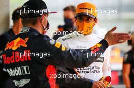 Carlos Sainz Jr (ESP) McLaren with Max Verstappen (NLD) Red Bull Racing in qualifying parc ferme. 11.07.2020. Formula 1 World Championship, Rd 2, Steiermark Grand Prix, Spielberg, Austria, Qualifying Day.