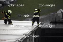 Firemen removing a water logged roof of a teams hospitality unit. 11.07.2020. Formula 1 World Championship, Rd 2, Steiermark Grand Prix, Spielberg, Austria, Qualifying Day.