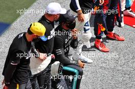 Lewis Hamilton (GBR) Mercedes AMG F1 takes a knee with team mate Valtteri Bottas (FIN) Mercedes AMG F1 on the grid. 12.07.2020. Formula 1 World Championship, Rd 2, Steiermark Grand Prix, Spielberg, Austria, Race Day.