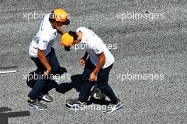 Carlos Sainz Jr (ESP) McLaren and team mate Lando Norris (GBR) McLaren play football on the start / finish straight. 09.07.2020. Formula 1 World Championship, Rd 2, Steiermark Grand Prix, Spielberg, Austria, Preparation Day.