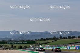 Sergio Perez (MEX) Racing Point F1 Team RP19 and Sebastian Vettel (GER) Ferrari SF1000. 11.09.2020. Formula 1 World Championship, Rd 9, Tuscan Grand Prix, Mugello, Italy, Practice Day.