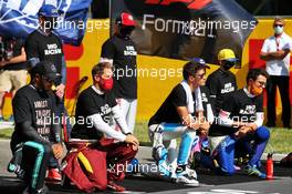 Grid atmosphere - drivers end racism message (L to R): Lewis Hamilton (GBR) Mercedes AMG F1 and Sebastian Vettel (GER) Ferrari. 13.09.2020. Formula 1 World Championship, Rd 9, Tuscan Grand Prix, Mugello, Italy, Race Day.