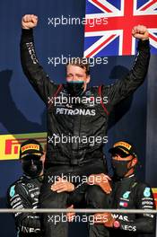 Valtteri Bottas (FIN) Mercedes AMG F1 and Lewis Hamilton (GBR) Mercedes AMG F1 celebrate on the podium with a team member. 13.09.2020. Formula 1 World Championship, Rd 9, Tuscan Grand Prix, Mugello, Italy, Race Day.
