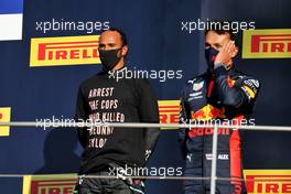 (L to R): Race winner Lewis Hamilton (GBR) Mercedes AMG F1 celebrates on the podium with third placed Alexander Albon (THA) Red Bull Racing. 13.09.2020. Formula 1 World Championship, Rd 9, Tuscan Grand Prix, Mugello, Italy, Race Day.